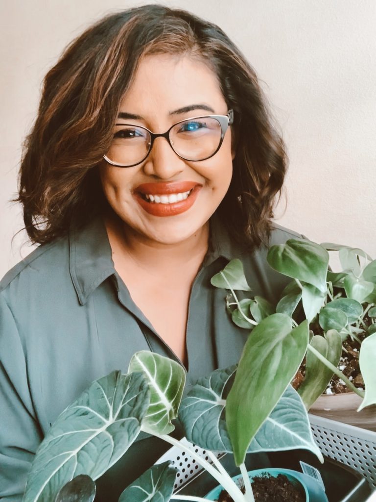 Woman holding house plant